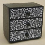 Op Art Cabinet
Phil Sargent Op Art Cabinet Phil Sargent (H) 72mm x (W) 76mm x (D) 45mm Recycled cardboard with laminated print